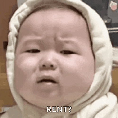 a baby wearing a hooded sweatshirt is crying and asking for rent .