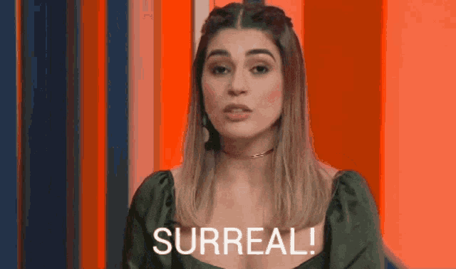 a woman in a green dress says " surreal "