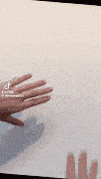 a tik tok video of a person 's hands