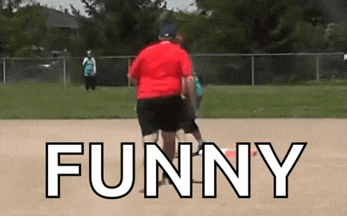 a man in a red shirt is standing on a baseball field with the word funny above him