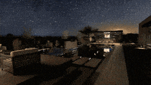 a swimming pool at night with the milky way in the background