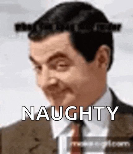 a man in a suit and tie is making a funny face and the word naughty is visible behind him .