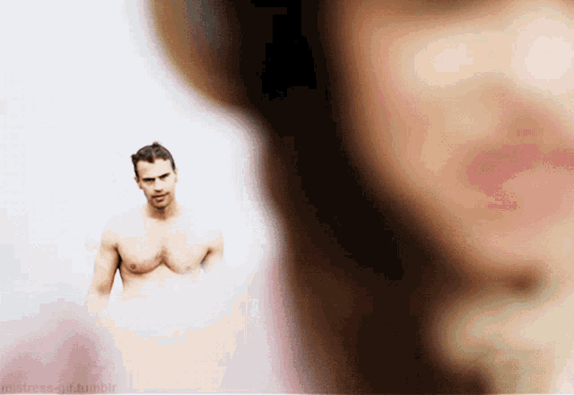 a man without a shirt is standing in front of a woman with the words mistress-girl tumblr visible