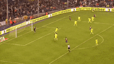 a soccer game is being played on a field with productos weber banners