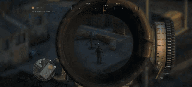 a sniper scope shows a target with a yellow circle in the upper right corner