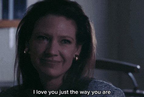 a woman says i love you just the way you are in a dark room