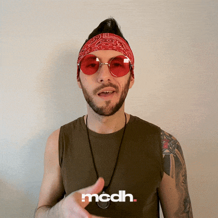 a man wearing red sunglasses and a bandana has the word mcdh written on his shirt