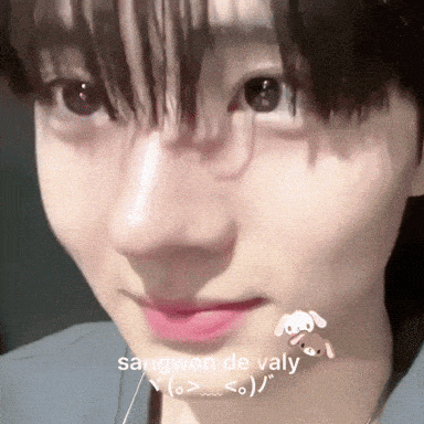 a close up of a person 's face with the words sangwon de valy written in white