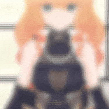 a blurred image of a girl with orange hair and green eyes