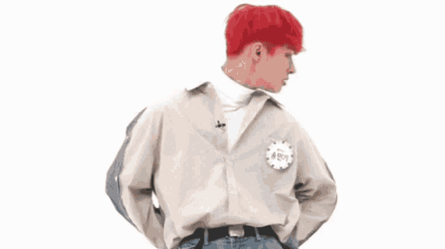 a man with red hair wearing a white shirt