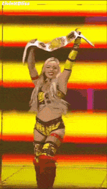 a woman in a wrestling outfit is holding a championship belt