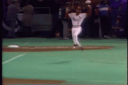 a baseball player with the number 1 on his jersey is throwing a baseball