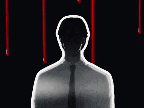 a man in a white shirt and tie is standing in front of a sign that says bakamashi