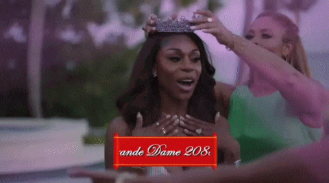 a woman with a crown on her head is surrounded by other women and a sign that says ande dame 208