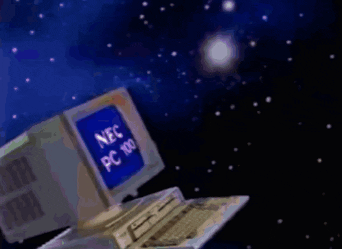 a nec pc 100 computer is in space with a person pointing at it