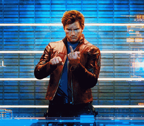 a man in a leather jacket is making a middle finger gesture