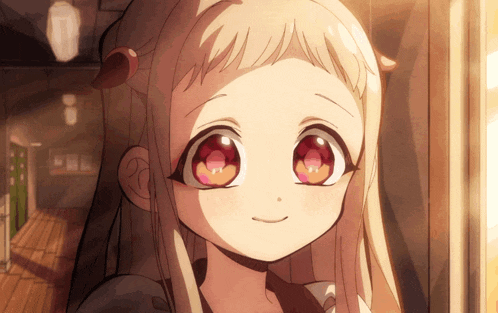 a girl with blonde hair and red eyes is smiling and looking at the camera