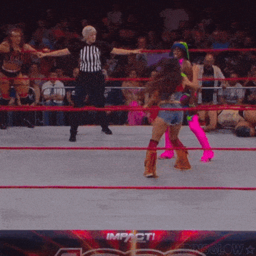 a female wrestler in a ring with the word impact on the bottom