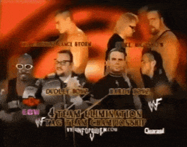 a group of men are standing in front of a sign that says " 4 team elimination tag team championship "