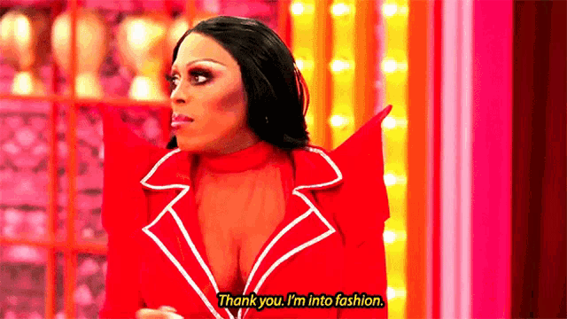 a woman in a red jacket is saying thank you i 'm into fashion