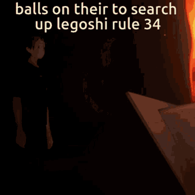 a man is standing in front of a fire with the words " balls on their to search up legoshi rule 34 "