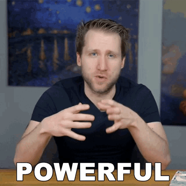 a man sitting at a table with the word powerful written in white letters