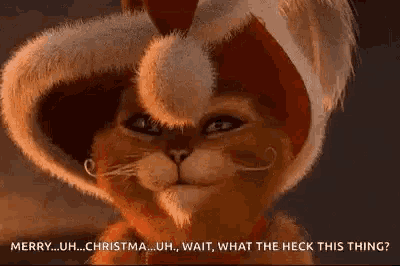 a cartoon cat is wearing a santa hat and eating a christmas present .