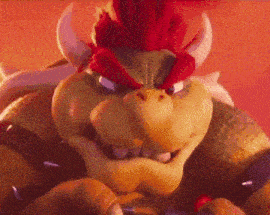 a close up of a cartoon character with horns and a feathered head .