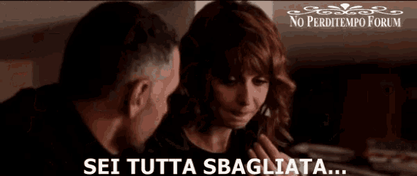 a man and a woman are looking at each other with the words sei tutta sbagliata written below them