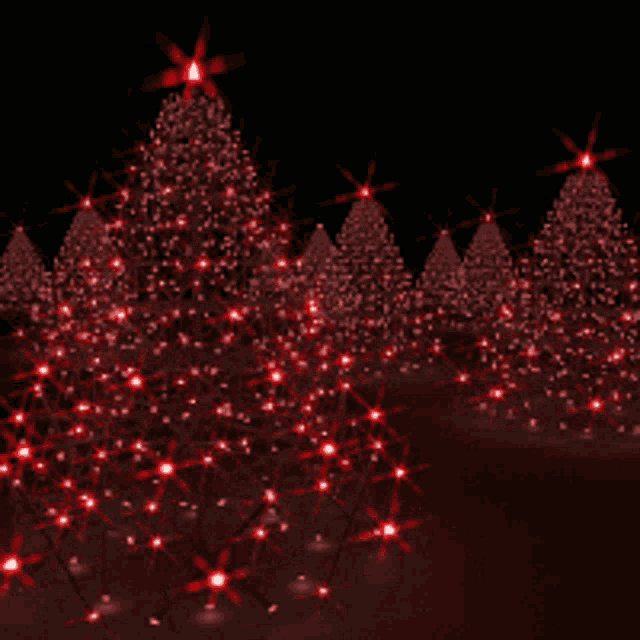 a row of red christmas trees with red lights on them