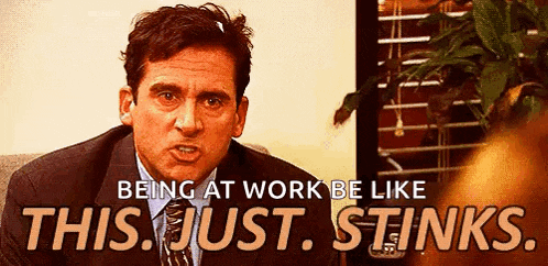 a man in a suit and tie is making a funny face and saying `` being at work be like this just stinks ''