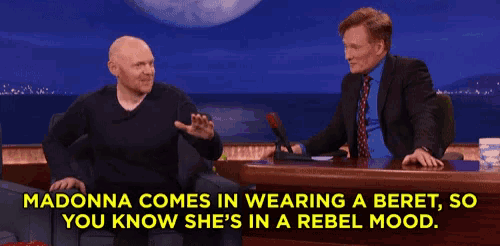 madonna comes in wearing a beret , so you know she 's in a rebel mood .