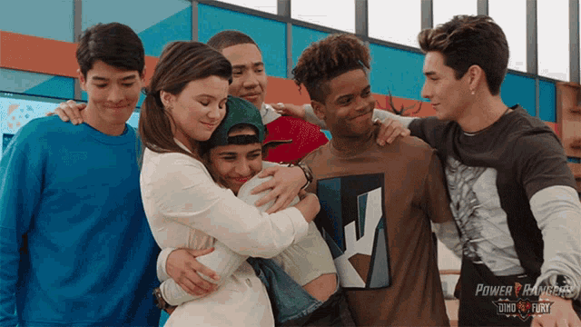 a group of young people are posing for a picture with the power rangers logo on the bottom