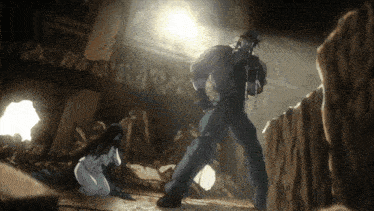 a man standing next to a woman in a cave