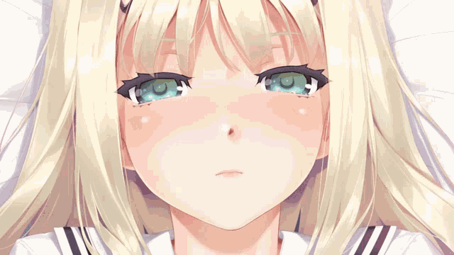 a close up of a girl 's face with blonde hair and green eyes