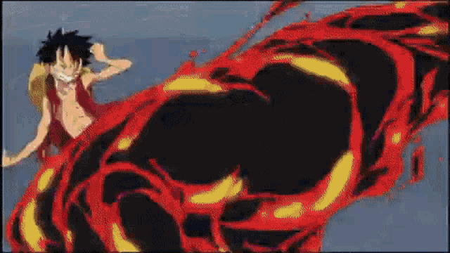a monkey d luffy from one piece is standing next to a giant fireball .