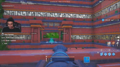 a man is playing a video game with the name aim cannon at the top of the screen