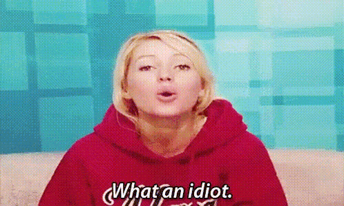 a woman in a red hoodie is saying `` what an idiot '' .