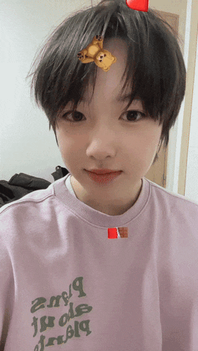 a person wearing a pink shirt that says jungle