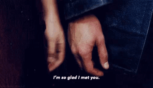 a close up of a person 's hand with the words `` i 'm so glad i met you '' written below it .