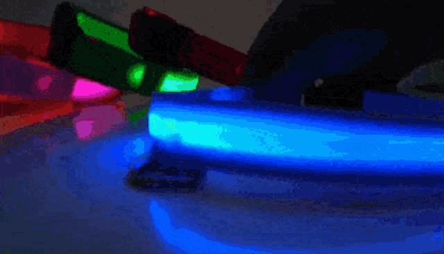 a glow in the dark dog collar with a blue light on it