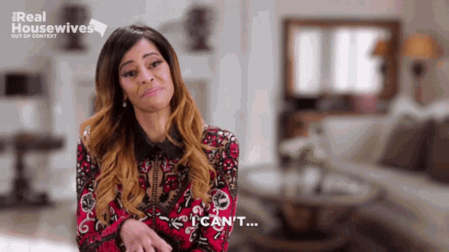 a woman says i can 't in front of a sign that says real housewives out of context