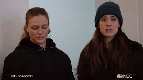 two women standing next to each other with the hashtag #chicagopd on the bottom right