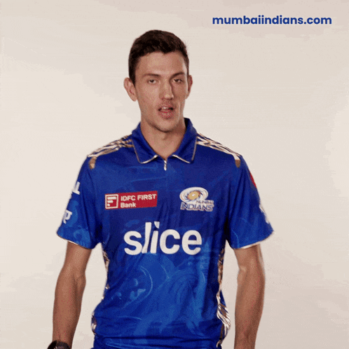 a man wearing a blue shirt that says slice on the front