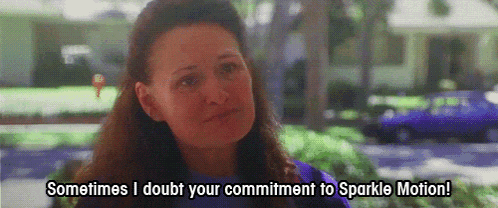 a woman says " sometimes i doubt your commitment to sparkle motion " in front of a purple car