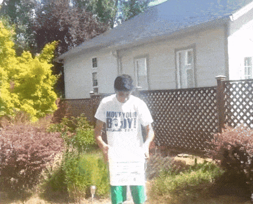 a man wearing a white shirt that says " mouf your body "