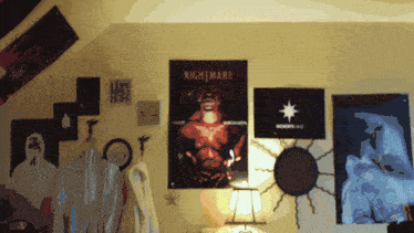 a nightmare poster hangs on a wall next to other posters
