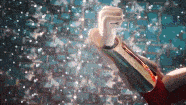 a close up of a person 's fist against a blue background