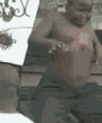 a shirtless man is sitting in front of a sign that says motel