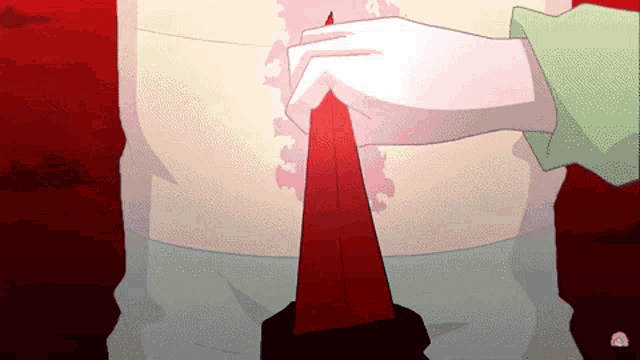 a person is holding a red object in their hands